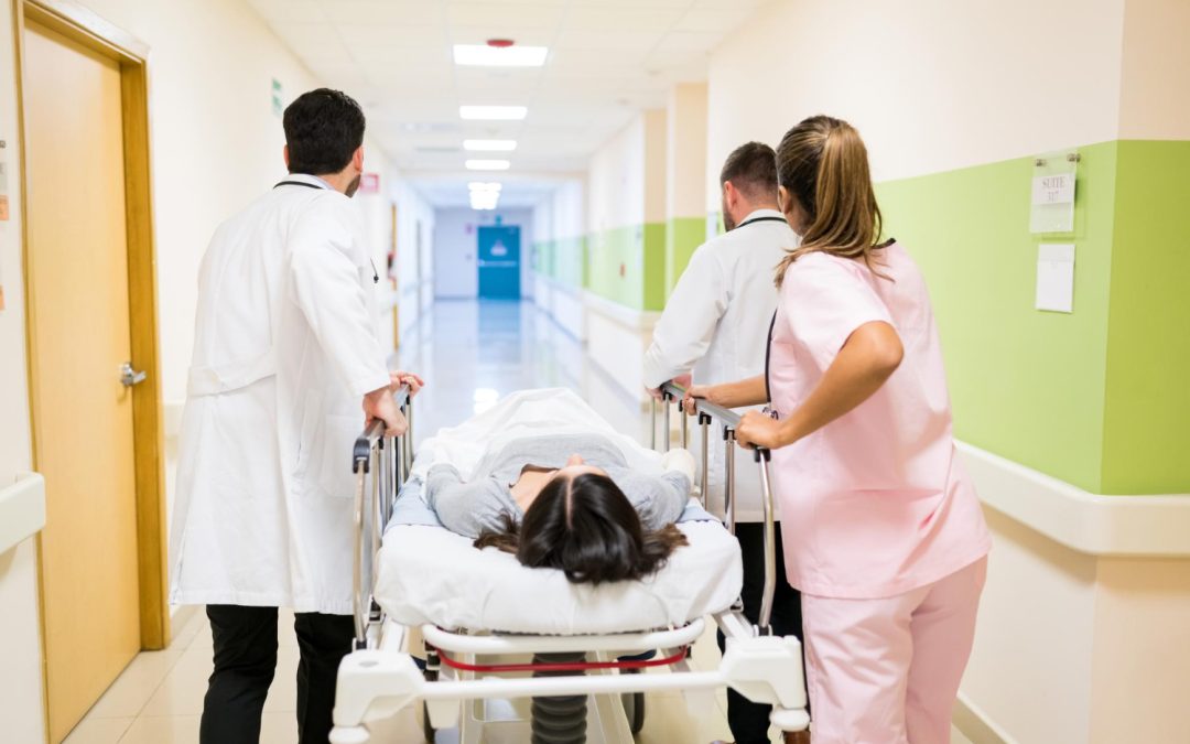 Medical personnel assisting a patient on a stretcher through the bustling hospital corridor, ensuring they receive immediate attention in urgent care.